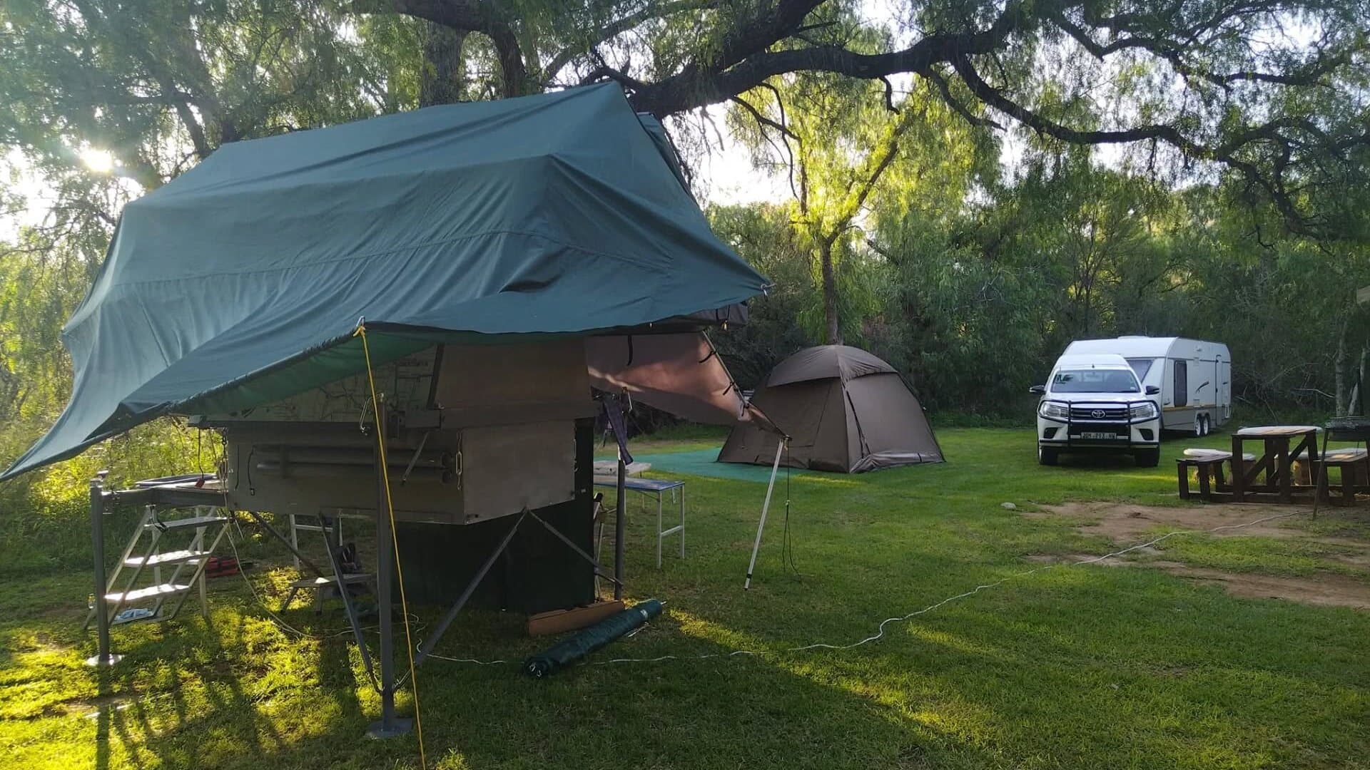 Rooftop tent camping setup at Red Dune Camp